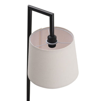 View of linen lampshade opening and light socket on a black floor lamp.