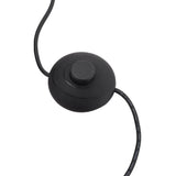 Black foot switch and power cord on metal tray table floor lamp