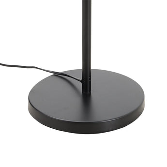 Black round base of industrial floor light with upright support pole