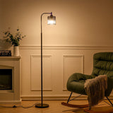 Industrial metal floor light with black mesh lampshade and round base