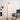 Black industrial floor lamp with metal mesh shade and exposed bulb inside