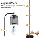 Metal floor lamp with black pole, mesh drum shade and round base