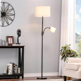 Black floor lamp with fabric drum shade and swiveling side lamp head on base