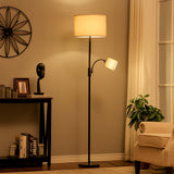 Black floor lamp with beige drum shade and adjustable side spotlight on arm