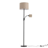 Black floor lamp with beige fabric drum shade and angled spotlight head
