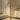 Black base traditional floor lamp with woven rattan dome shade