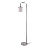 Floor lamp on round base with tall metal stem and small clear glass bell shade
