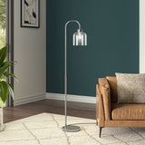 Modern floor lamp with chrome pole, round base, and clear glass shade over bulb