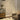 Modern standing floor lamp with arched metal frame and clear glass dome shade