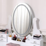 White vanity mirror with round edge, drawers and vanity accessories on top