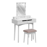 White makeup vanity desk with lighted mirror, two drawers, and beige padded stool