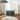 Green upholstered storage ottoman with hinged lid and wooden legs, teddy fleece finish.