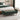 Green chenille storage bench with padded tufted top and tapered wooden legs
