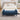 Blue chenille storage bench with tufted top and black tapered legs