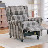 Recliner armchair in gray plaid fabric with studded sides, cushioned footrest up