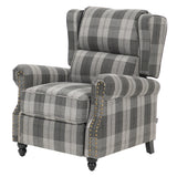 Pushback recliner chair with gray plaid upholstery, padded arms and studded trim