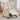 Floral recliner chair with cream fabric, red rose pattern, button trim, wooden legs