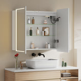 Double-door bathroom mirror cabinet open to reveal shelves and built-in wiring
