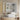 Double-door bathroom mirror cabinet open to reveal shelves and built-in wiring
