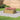 Plastic raised garden bed planter with wood-grain design, tall rectangular frame