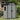 Apex Roof Garden Tool Shed, light gray panels with black trim and hinged double doors