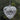 Heart-shaped glass ornament with silver beaded pattern inside the heart