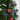 Heart-shaped glass ornaments on a Christmas tree with iridescent rainbow sheen