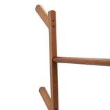 Close-up of bamboo side pegs and horizontal bar on freestanding coat rack