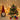Mini artificial Christmas tree with gold star, multicolor baubles, lights, gift boxes