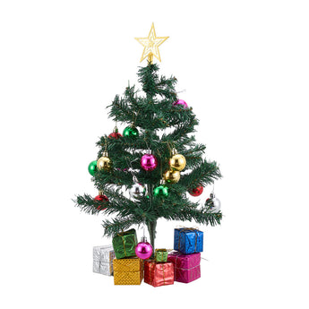 Mini artificial Christmas tree with gold star, purple and gold ornaments, lit lights, gift boxes