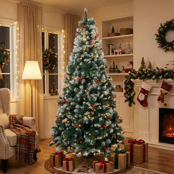 Artificial Christmas tree with lit tips, red ornaments, on metal stand.
