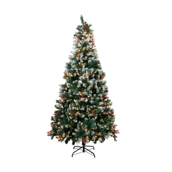 Artificial Christmas tree with lit branches, red and gold ornaments, on metal stand.