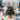 Tabletop Christmas tree decoration with gold star topper, colorful baubles, LED lights in pot