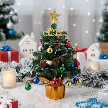 Tabletop Christmas tree decoration with gold star topper, colorful baubles, LED lights in pot