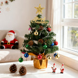 Tabletop Christmas tree decoration in a gold cup pot with gold star topper, LED lights, ornaments