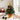 Tabletop Christmas tree decoration in a gold cup pot with gold star topper, LED lights, ornaments