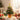 Small tabletop Christmas tree decoration with gold star topper and mixed bauble ornaments, LED lights