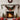 Christmas garland swag with green foliage, red ornaments and poinsettias, Merry Christmas sign, red bow