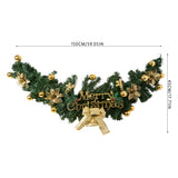 Christmas garland swag with green foliage, gold baubles and ribbon, and Merry Christmas sign
