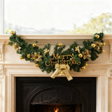 Christmas garland swag with green foliage, gold baubles, pinecones, and Merry Christmas sign