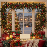 Artificial Christmas wreath with green pine foliage, red baubles, and warm LED lights