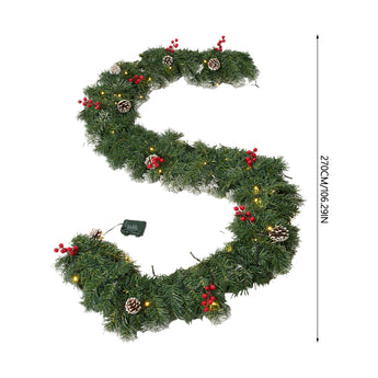 Artificial Christmas wreath with frosted green pine, red berries, pine cones, and warm LED lights