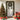 Artificial Christmas wreath with green foliage, red and gold ornaments, and warm LED lights