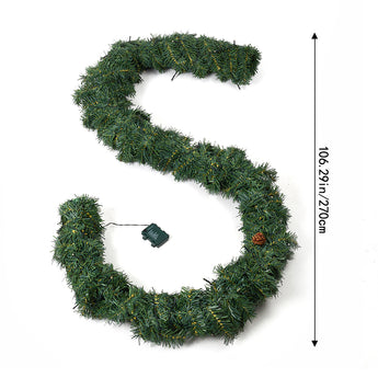 Artificial Christmas garland wreath with warm LED lights, green tinsel-style