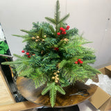 Artificial Christmas tree urn filler decoration with green needles, red berries, warm white lights