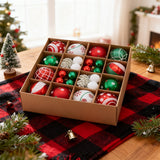 Cardboard box of Christmas tree ornaments in red, green, and white baubles and snowflakes.