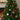 Christmas tree ornaments: red, green, and striped baubles hanging on branches