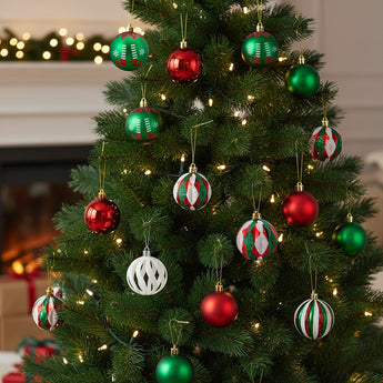 Christmas tree ornaments: red, green, and striped baubles hanging on branches