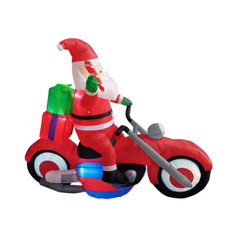 Inflatable Santa riding red motorcycle with gray handlebars, green gift bag