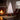 Pre-lit artificial Christmas tree with warm white LED lights on metal stand, full tree